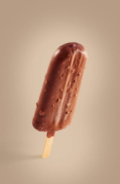 istock Chocolate covered ice cream on a brown background 1136653339