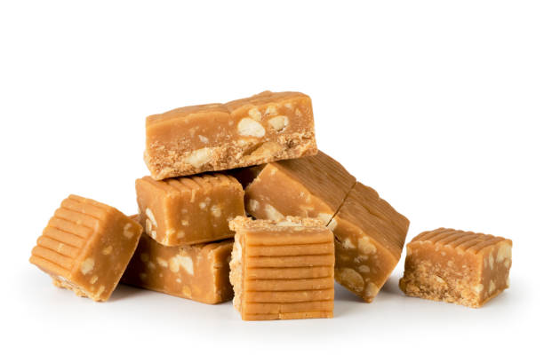 istock Heap of candy, toffee with peanuts on a white, isolated. 1136653746