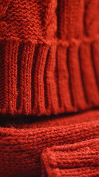 istock Cold winter clothing - knitted red hat and scarf 1136654586