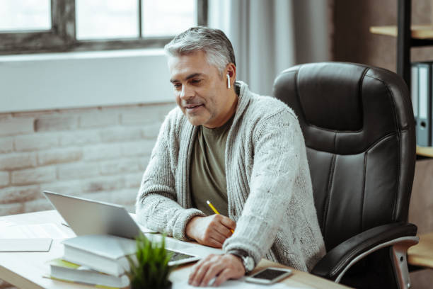istock Nice smart businessman sitting in his office 1136654715