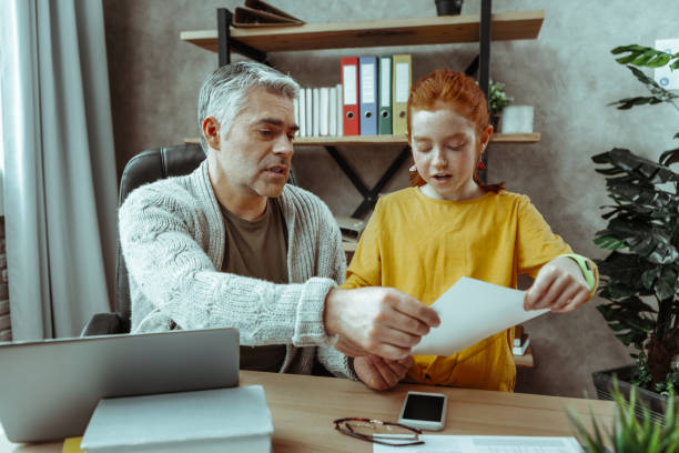 istock Nice pleasant girl standing near her father 1136654724