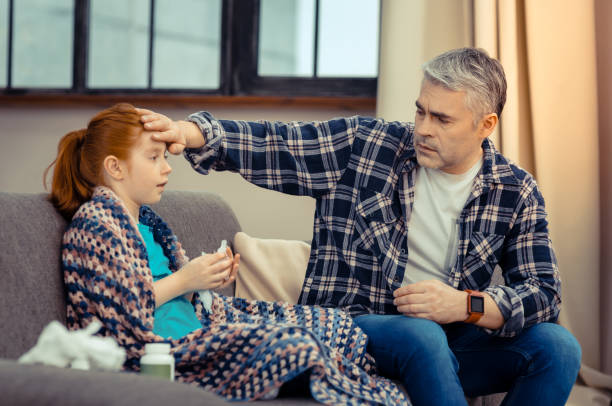 istock Nice good looking man worrying about his daughter 1136654934