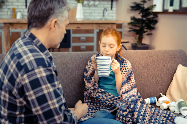 istock Nice pleasant girl holding a tea cup 1136654949