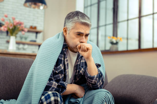 istock Depressed cheerless ill man having cold symptoms 1136655095