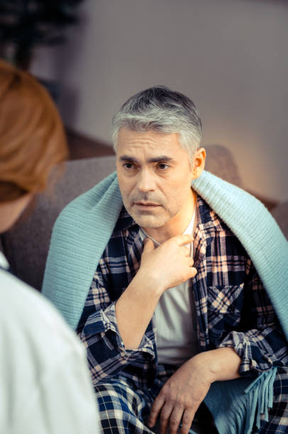 istock Pleasant good looking man speaking to his doctor 1136655118