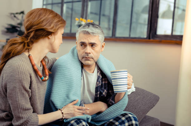 istock Cheerless sad man sitting with a cup of tea 1136655150