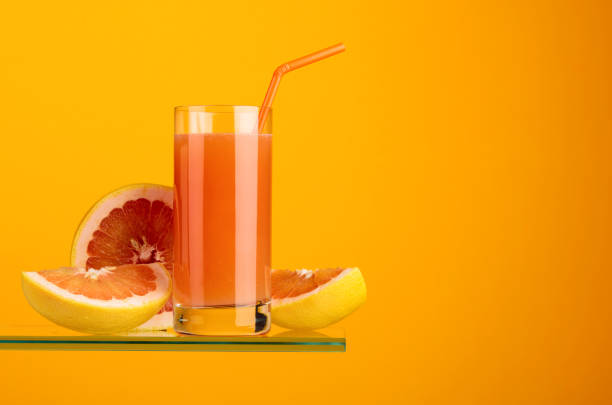 istock Glass of fresh grapefruit juice with fresh fruits. 1136656231