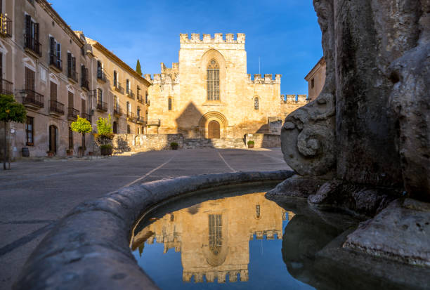 istock Church facade reflected in water in Santes Creus Monastery 1136656434