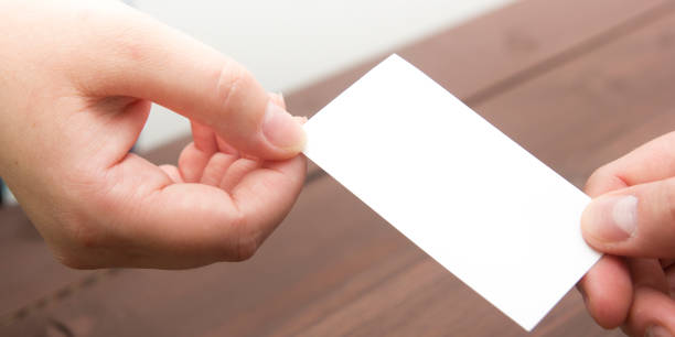 istock business executive exchanging business card blank 1136656495