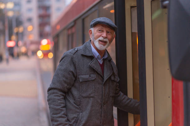istock Mature Man Entering a Bus 1136658074