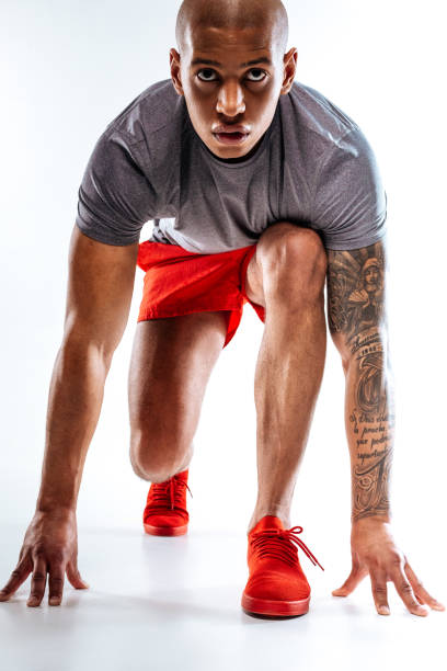 istock Sportive man starting to run from a low 1136658316
