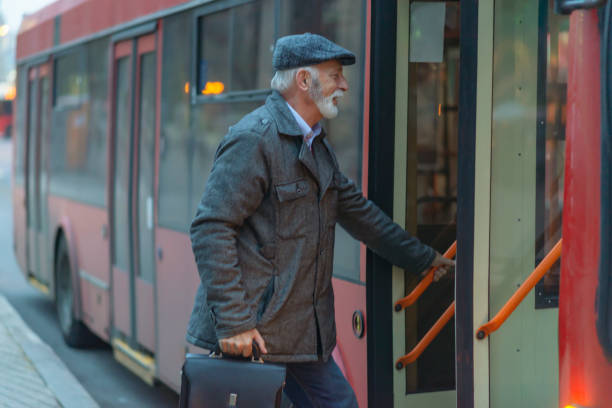istock Mature Man Entering a Bus 1136658345