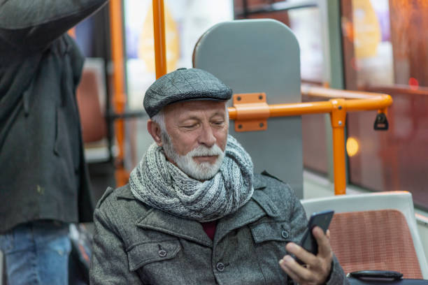 istock Mature Man Riding In A Bus 1136658496