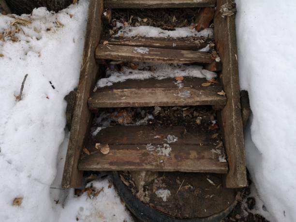 old wood staircase at the beginning of spring in the dirty melting snow - 11877 imagens e fotografias de stock