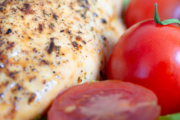 istock baked chicken breast with red tomatoes macro shot 1136661601