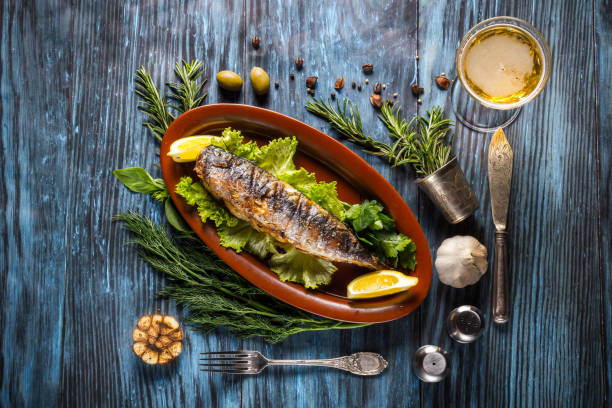 istock Grilled mackerel fillets with lemon on rustic background 1136661631