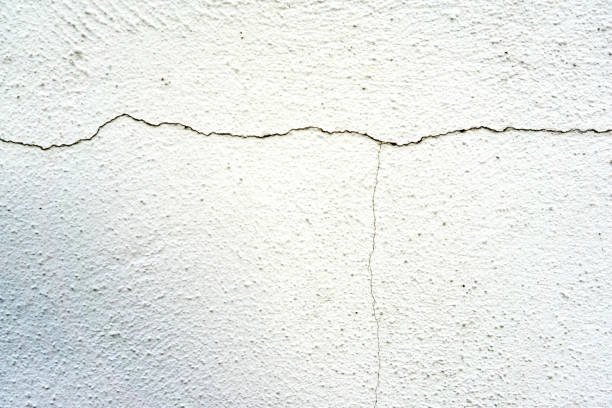 istock cracked color on a wall outside 1136665185