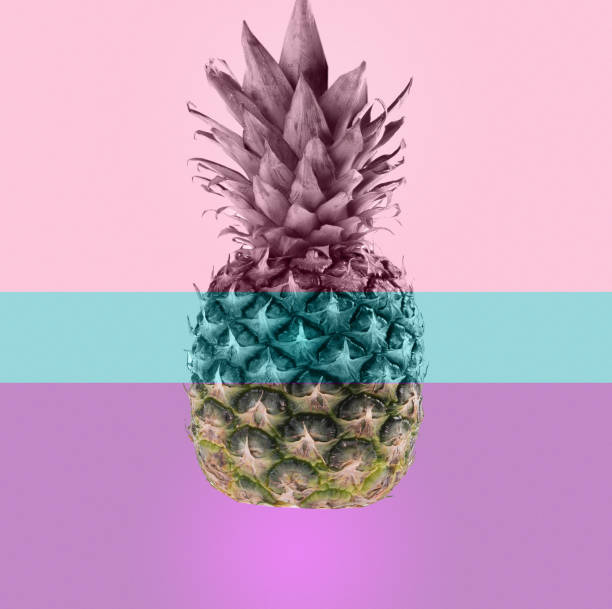 Pink pineapple on pink and blue pastel background.