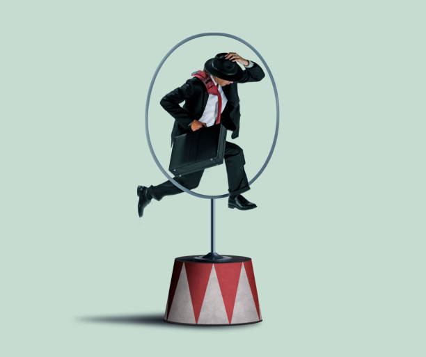Businessman Jumping Through A Hoop