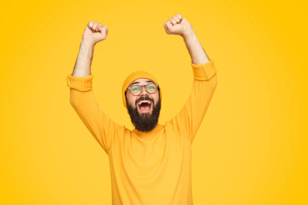 istock Stylish man celebrating success 1136668080
