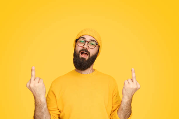 istock Funny man showing middle fingers 1136668086
