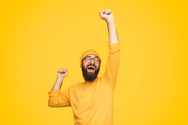 istock Excited bright man with fist up 1136668090