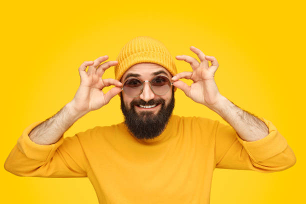 istock Funny man putting on shades 1136668122