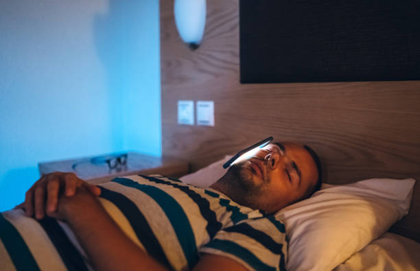 istock Man asleep with phone on his face 1136668181