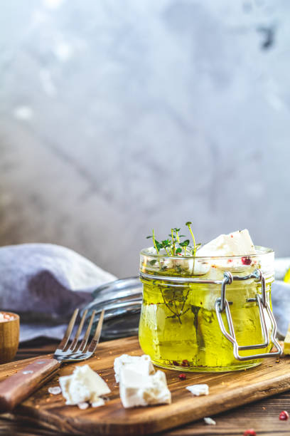 feta cheese marinated in olive oil in glass jar - restaurant pasta italian culture dinner imagens e fotografias de stock