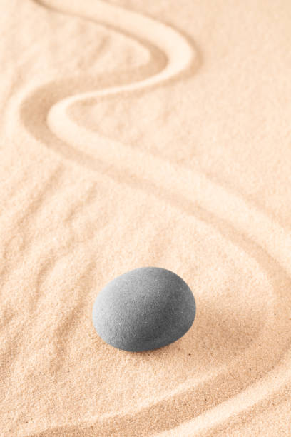 istock Raked sand and spa wellness healing stones 1136674200