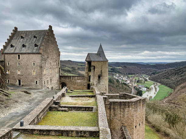 Vianden, Luxembourg - August 8, 2019: Flags at Vianden tower medieval ruin of Vianden in Luxembourg.
