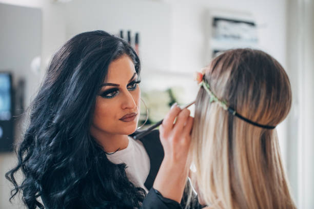 istock Professional makeup artist and a model 1136678257