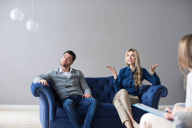 istock Couple at therapy session with psychologist. 1136678471