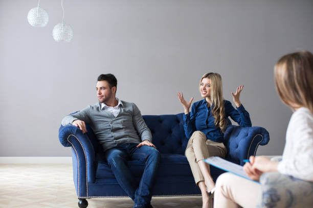 istock Couple at therapy session with psychologist. 1136678985