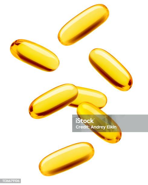 Falling Fish Oil Pill Omega 3 Isolated On White Background Clipping Path Full Depth Of Field Stock Photo - Download Image Now