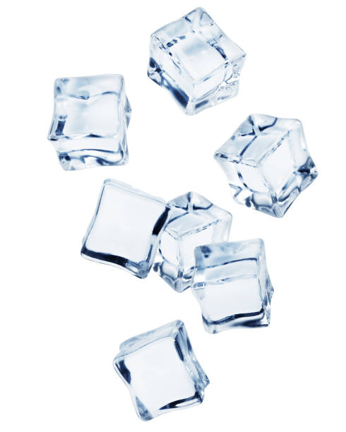 Falling ice cube, isolated on white background, clipping path, full depth of field Falling ice cube, isolated on white background, clipping path, full depth of field ice cube photos stock pictures, royalty-free photos & images