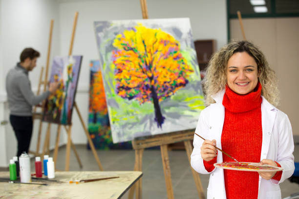 istock Fine art students working on painting 1136679282