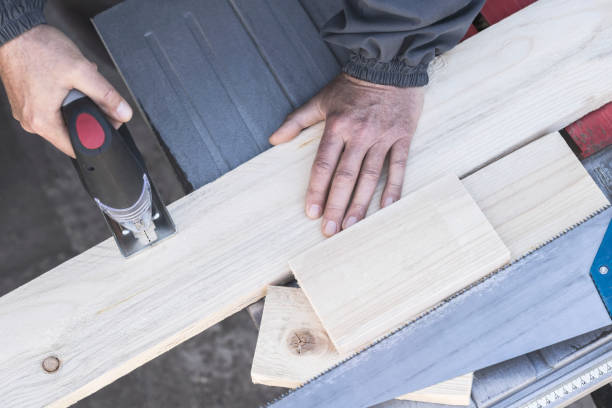 istock A carpenter working with jig saw and wood 1136679319