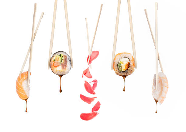 istock Set of different sushi rolls with chopsticks on a white background 1136679496