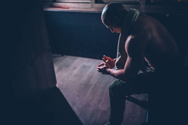 istock Man sitting at the locker room 1136681787