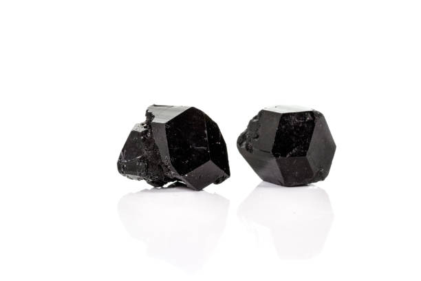 istock macro mineral stone schorl, black tourmaline on white background 1136683364