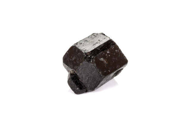 istock macro mineral stone schorl, black tourmaline on white background 1136684048