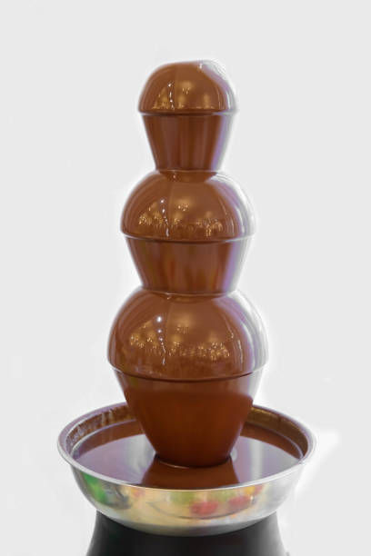 istock Liquid chocolate flows like a fountain. 1136684642