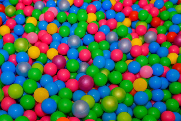 istock A lot of plastic colored balls. 1136684847