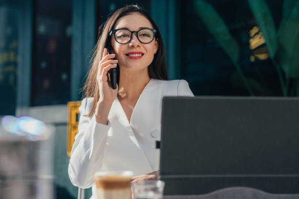 istock Pretty woman with eyeglasses is having a phone call 1136686806