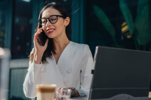 istock Happy, elegant woman is talking on mobile phone 1136687826