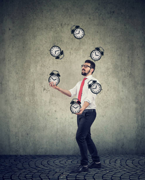 istock business man successfully juggling managing his time 1136688101