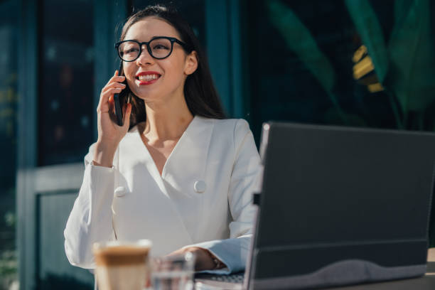 istock Cheerful woman is having a phone call 1136688134