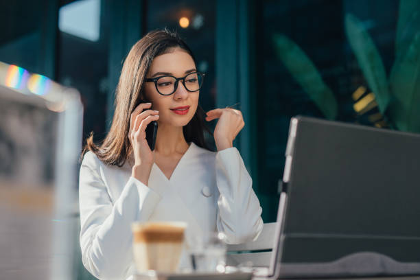 istock Charming young woman talking on phone 1136688206