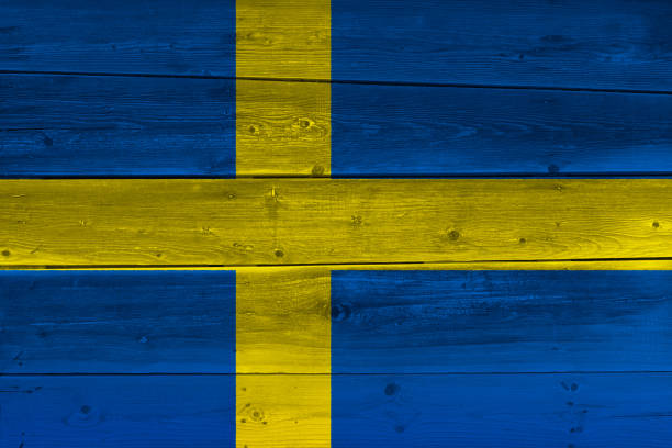 istock Sweden flag painted on old wood plank 1136691426